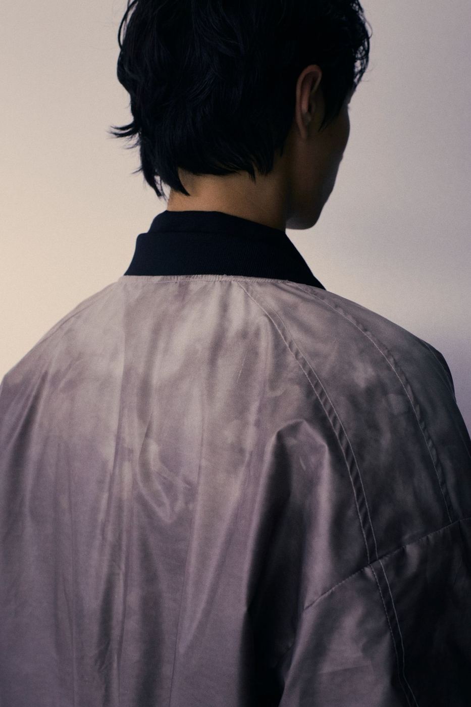 Washed bomber, close on the shoulder
