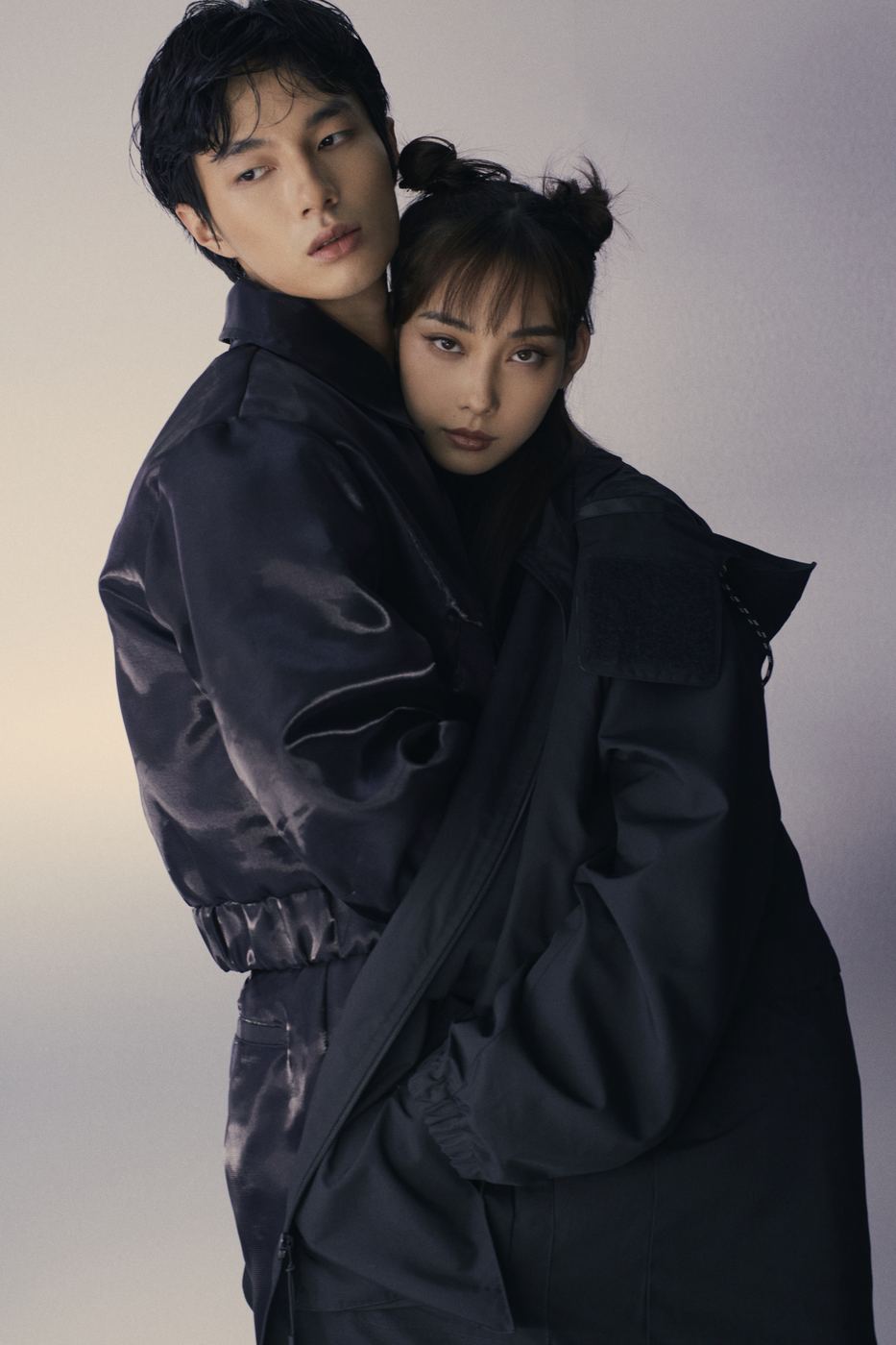 An embrace in black coats