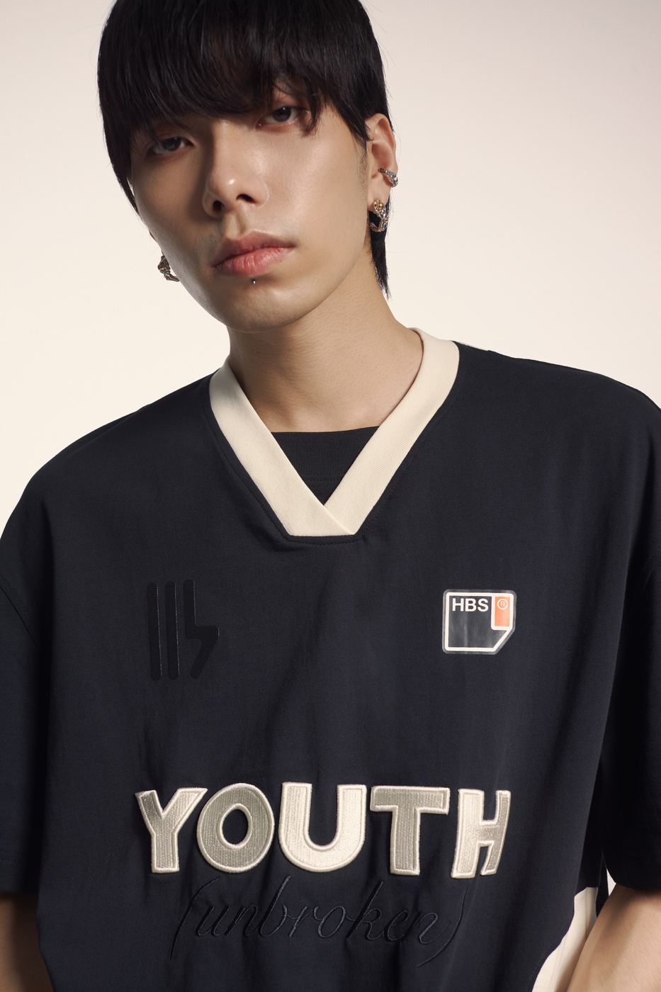 Black jersey with YOUTH across the chest