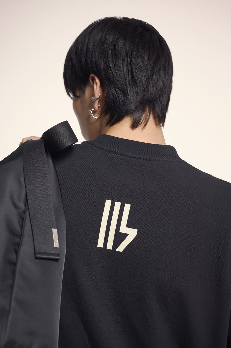 Black tee, small HBS mark on the back