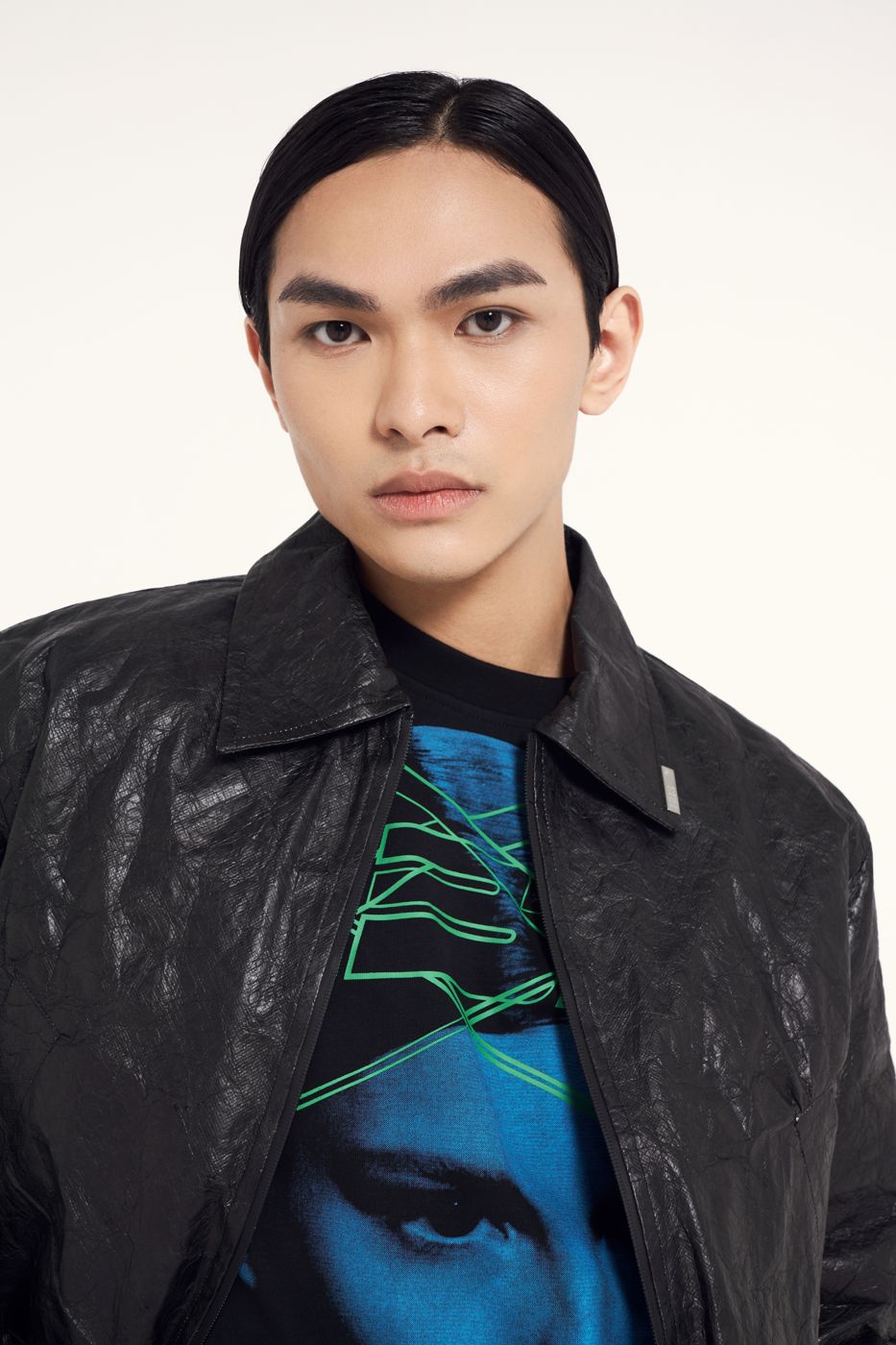 Creased leather over a printed face