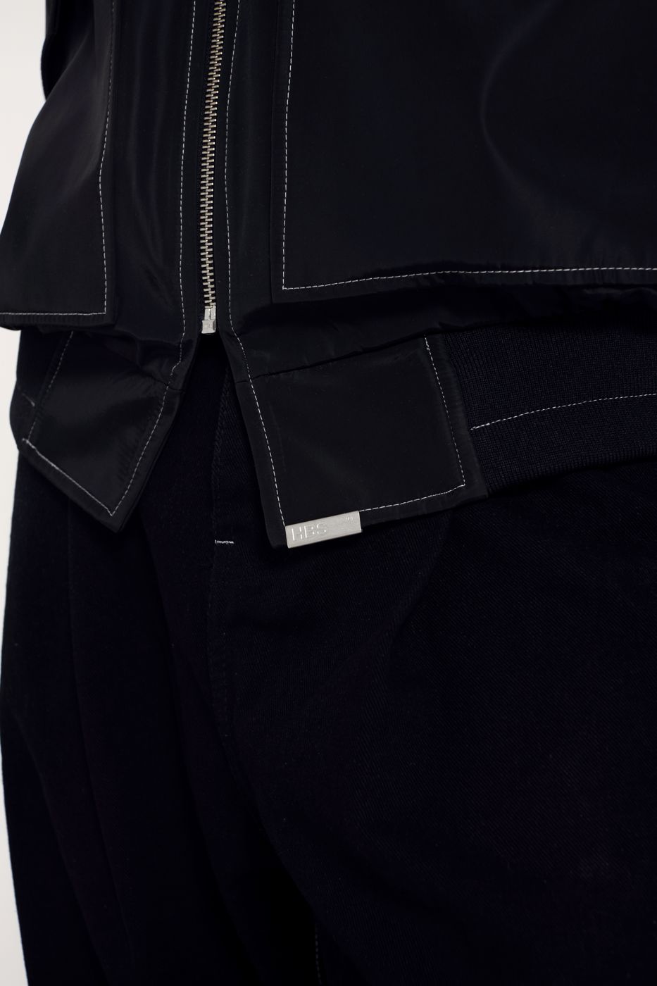 Black bomber, close on the hem and zip