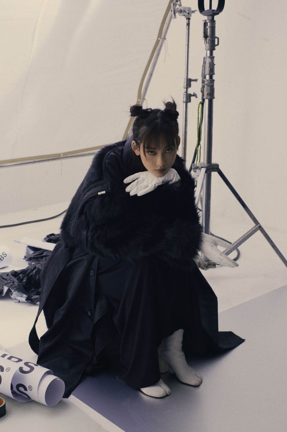 Between takes, seated among studio lights