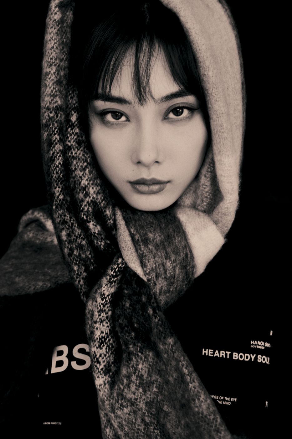 Black and white portrait, wool scarf over the head
