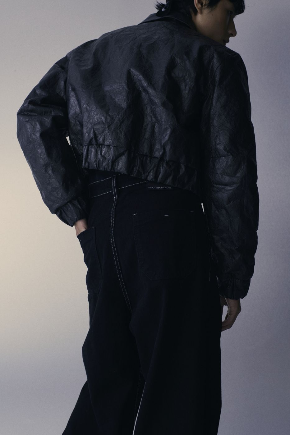 Creased leather jacket from behind